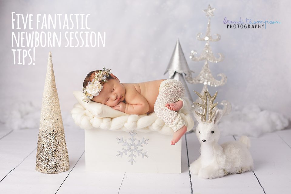 newborn photography - baby girl in white pants sleeping in a winter scene in plano, studio